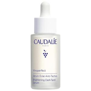 Caudalie Vinoperfect Brightening Dark Spot Serum in a frosted glass bottle with white dropper cap, 30ml skincare product for hyperpigmentation and dark spot correction