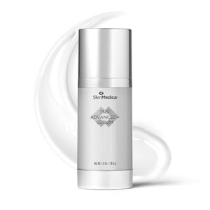 A product shot of the SkinMedica TNS Advanced+ Serum bottle, featuring a clean white-and-silver design with a pump dispenser. A white, creamy swirl is visible in the background, representing the serum's texture.