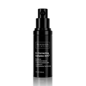 A product shot of the black bottle of Revision Skincare C+ Correcting Complex 30%® Face Serum. The label lists its key ingredients: "Exclusive antioxidant blend," "THD Ascorbate 30%," "Vitamin E," and "Microbiome Technology."